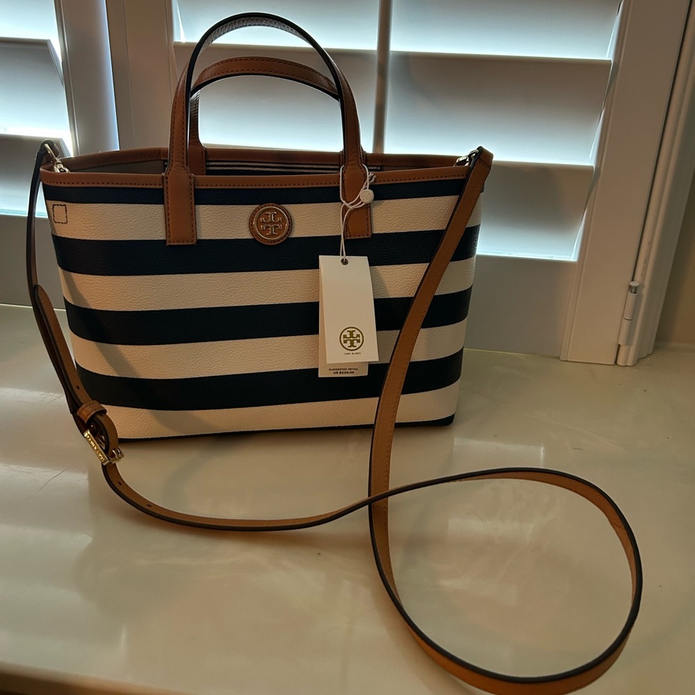 Brand new Tori Burch purse with matching wallet bag.